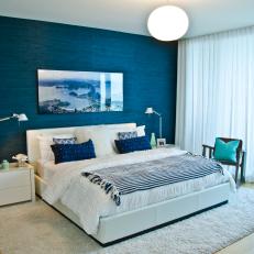 Blue and White Contemporary Bedroom With Water View