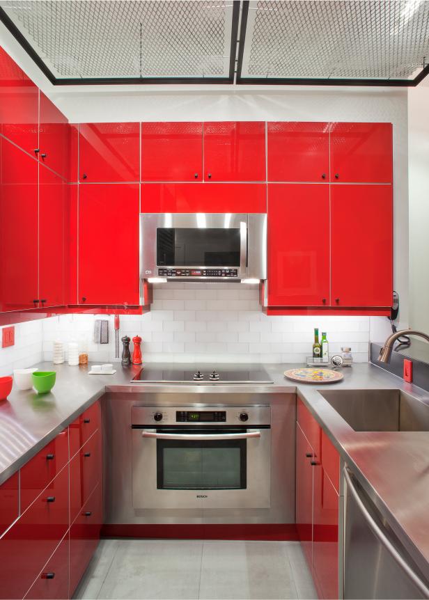 Kitchen with stainless steel appliances and red cabinets