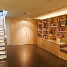 Contemporary Family Room Features Built-In Bookshelves