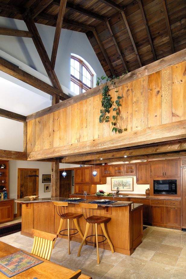 High Ceilinged Home Featuring Rustic Wood Kitchen And Dark