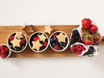 fruit cups topped with star shaped sugar cookies