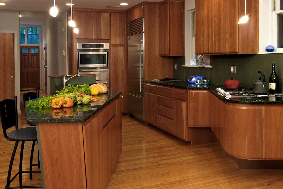 Modern Kitchen With Walnut Cabinets Black Marble Countertops Hgtv