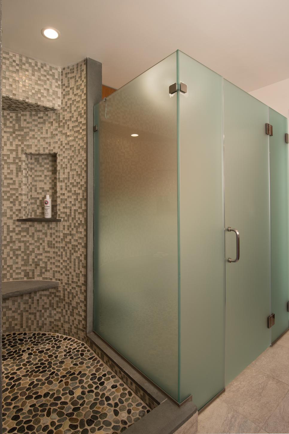 Stone Riverbed Design Extends Into Shower Area