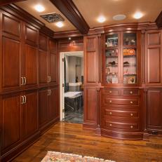 Handsome Closet Features Luxurious Wood & Custom Cabinetry