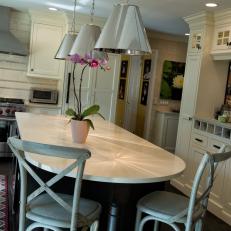 Fun Metal Pendant Lights Excite In A Transitional Kitchen With Large Island & Painted Industrial Chairs