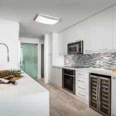 Modern White Galley Kitchen With Wine Refrigerator