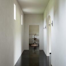 White Hallway With Sconces