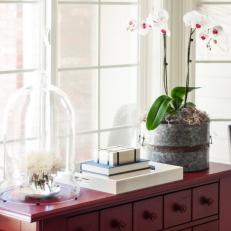 Natural Light Illuminates Charming Red Table With Orchid