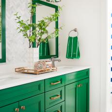Green and Neutral Bathroom with Mirrors, Patterned Wallpaper and Blue-and-White Rug