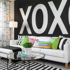 Living Room with Giant Letters in Black and White on Wall
