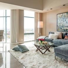 Living Room With Gray Velvet Sectional, Modern Art & Flokati Rug