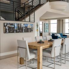 Large Staircase Creates Visual Impact in Dining Room