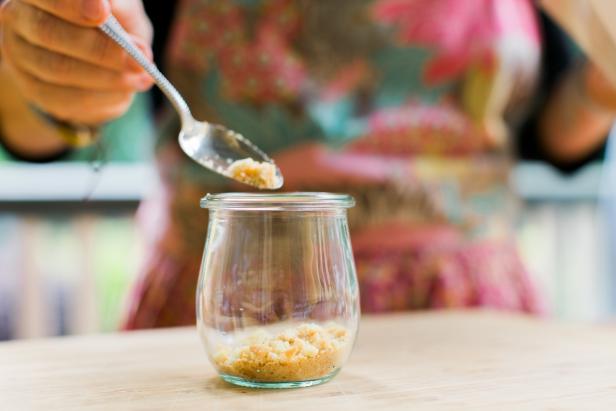 In a small glass jar, add 1/8 cup cookie crumbs (Image 1), then 1 tsp toasted coconut (Image 2), 1/3 cup pudding mixture (Image 3), 4-5 slices of banana (Image 4) and ¼ cup whipped cream (Image 5). Repeat until pudding or whipped cream reaches just below the rim of the jar (Image 6).