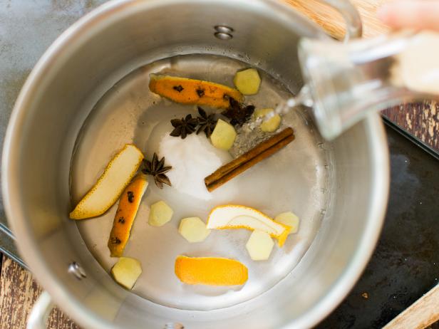 Combine orange peels, star anise, ginger, cinnamon sticks, water and sugar in a saucepan over medium heat . Bring to simmer and stir until sugar is dissolved. Cook on low heat for 10 minutes.