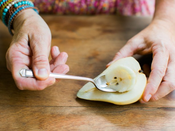 Peel the pears, then cut in half and using a spoon, scoop out the interior center of each pear, removing the seeds