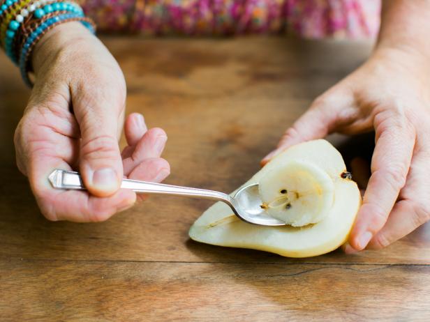 Peel the pears, then cut in half and using a spoon, scoop out the interior center of each pear, removing the seeds