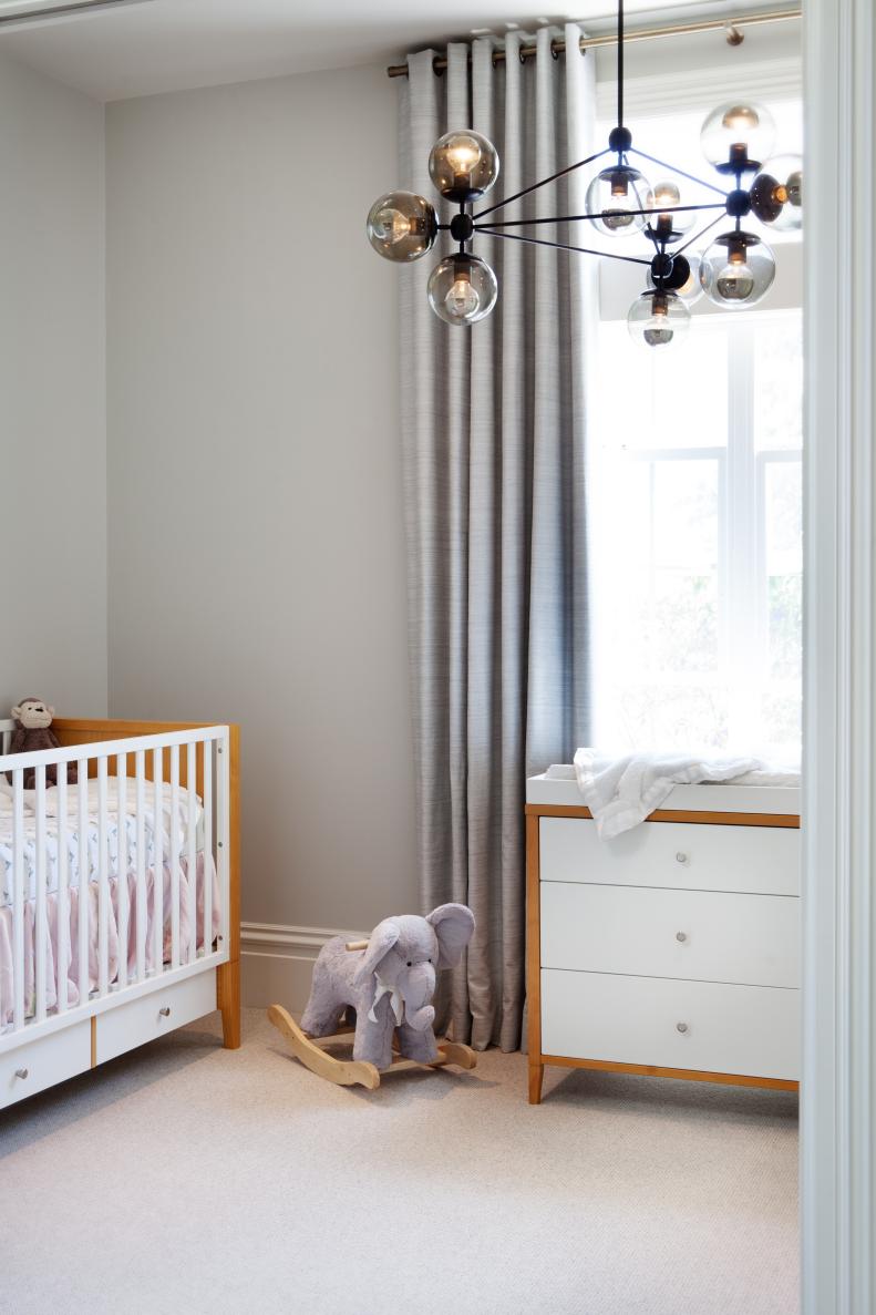 Modern Furniture and Light Fixture in Neutral Nursery 