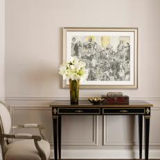 Heirloom Painting with Console and Chair in Elegant Neutral Living Room 