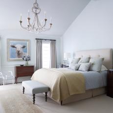 Neutral Master Bedroom with Soft Fabrics and Elegant Chandelier