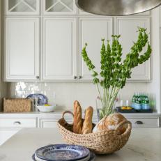 Gray and White Marble Countertops and White Custom Cabinets Give Elegance to Country Kitchen