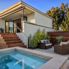 Contemporary Concrete Pool Deck With Wood Privacy Wall