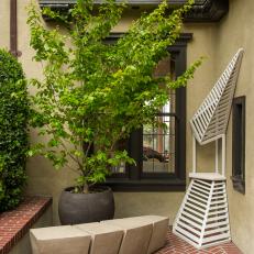 Drought-Tolerant Shrubs and Artwork Fill Otherwise Blank Corners