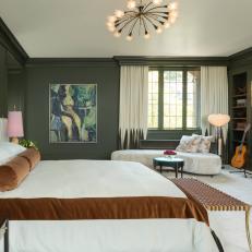 Bedroom Offers 1970s Vibe With Dark Walls and Plush, Cream-Colored Fabrics