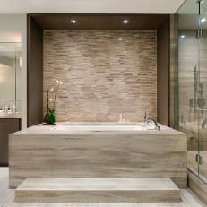 Neutral Contemporary Bathroom Boasts Stone Bathtub 