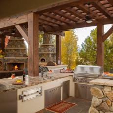 Rustic Outdoor Kitchen With Stainless Steel Appliances