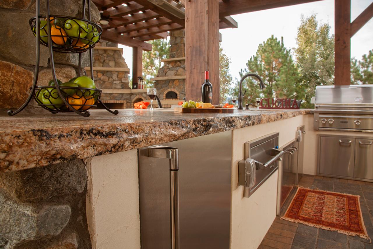 Raw Edge Granite Countertops in Rustic Outdoor Kitchen | HGTV