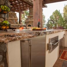 Raw Edge Granite Countertops in Rustic Outdoor Kitchen