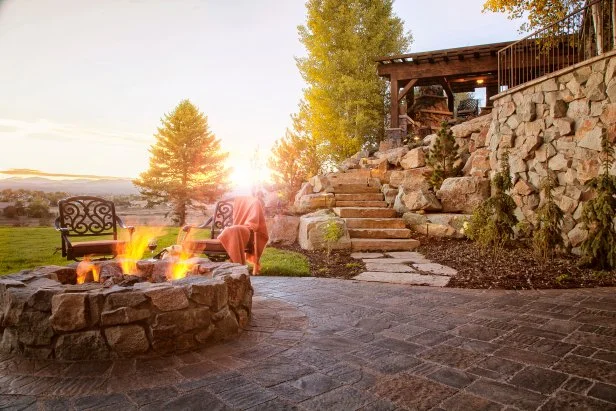 Cozy Patio with Stone Fire Pit Offers Breathtaking Views | HGTV