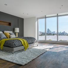 Gray Contemporary Urban Bedroom With Wraparound Windows