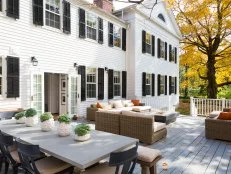 White Colonial Home Exterior With Back Deck for Outdoor Living