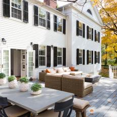 White Colonial Home With Large Back Deck