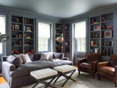 Blue Library With Transitional Style and Built-In Bookcases