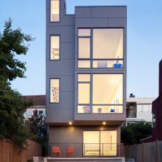 Rear Facade of Tall, Slender Home With Large Windows