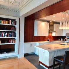 Brown and White Open Plan Kitchen and Bookshelf