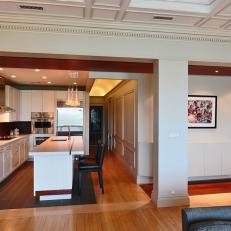 Brown and White Open Plan Kitchen With Column