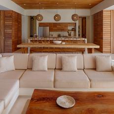 Brown and White Tropical Great Room With Sectional