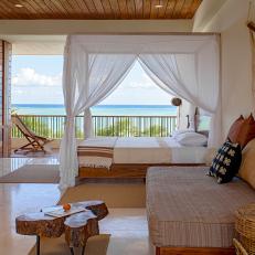 White and Brown Ocean View Bedroom With Canopy Bed