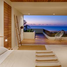 Neutral Ocean View Bedroom With Deck
