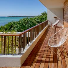 Beachfront Balcony With White Chair
