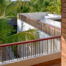 Balcony With Railing and Palm Trees