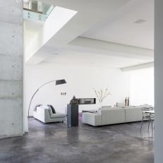 Gray and White Modern Living Room With Arc Lamp