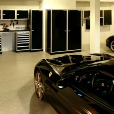 Spacious Garage With Black Cabinets & Tool Storage
