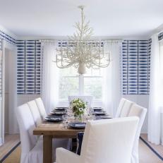 Blue and White Coastal Dining Room With Graphic Wallpaper