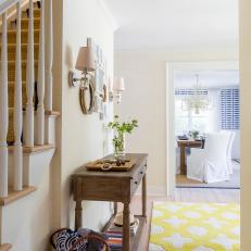 Neutral Transitional Foyer With Yellow Rug