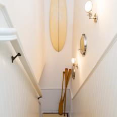 White Coastal Hallway With Surfboard