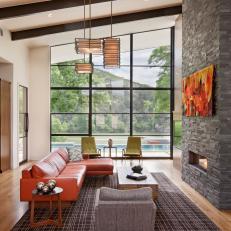 Open, Contemporary Living Room Features Natural Stone Fireplace